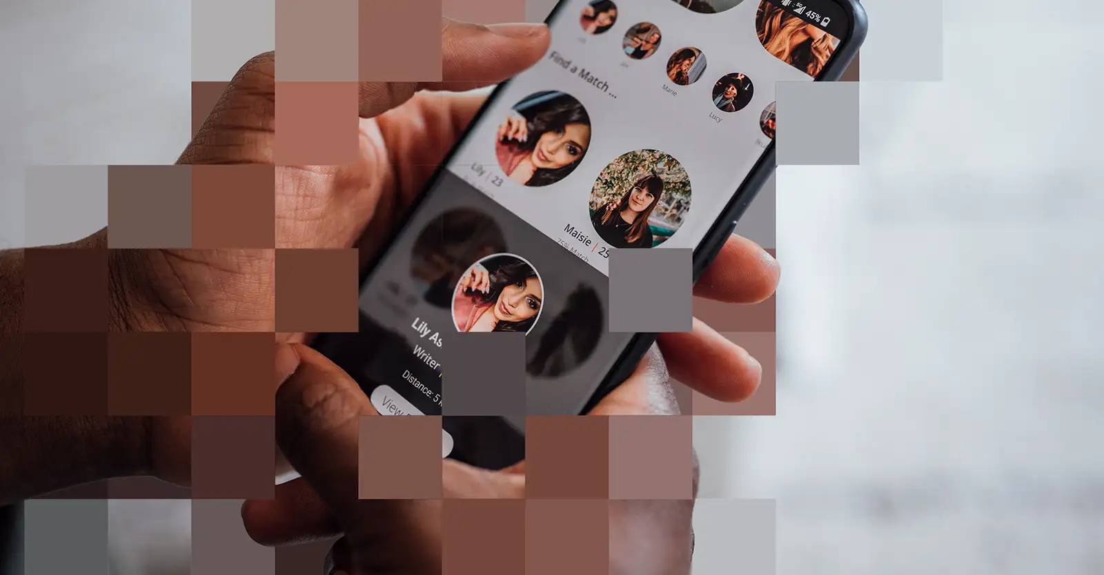 A close up of a man’s hands holding a mobile phone. On screen is a series of women’s dating profiles. Small coloured squares cover parts of the image, giving a pixellated look.