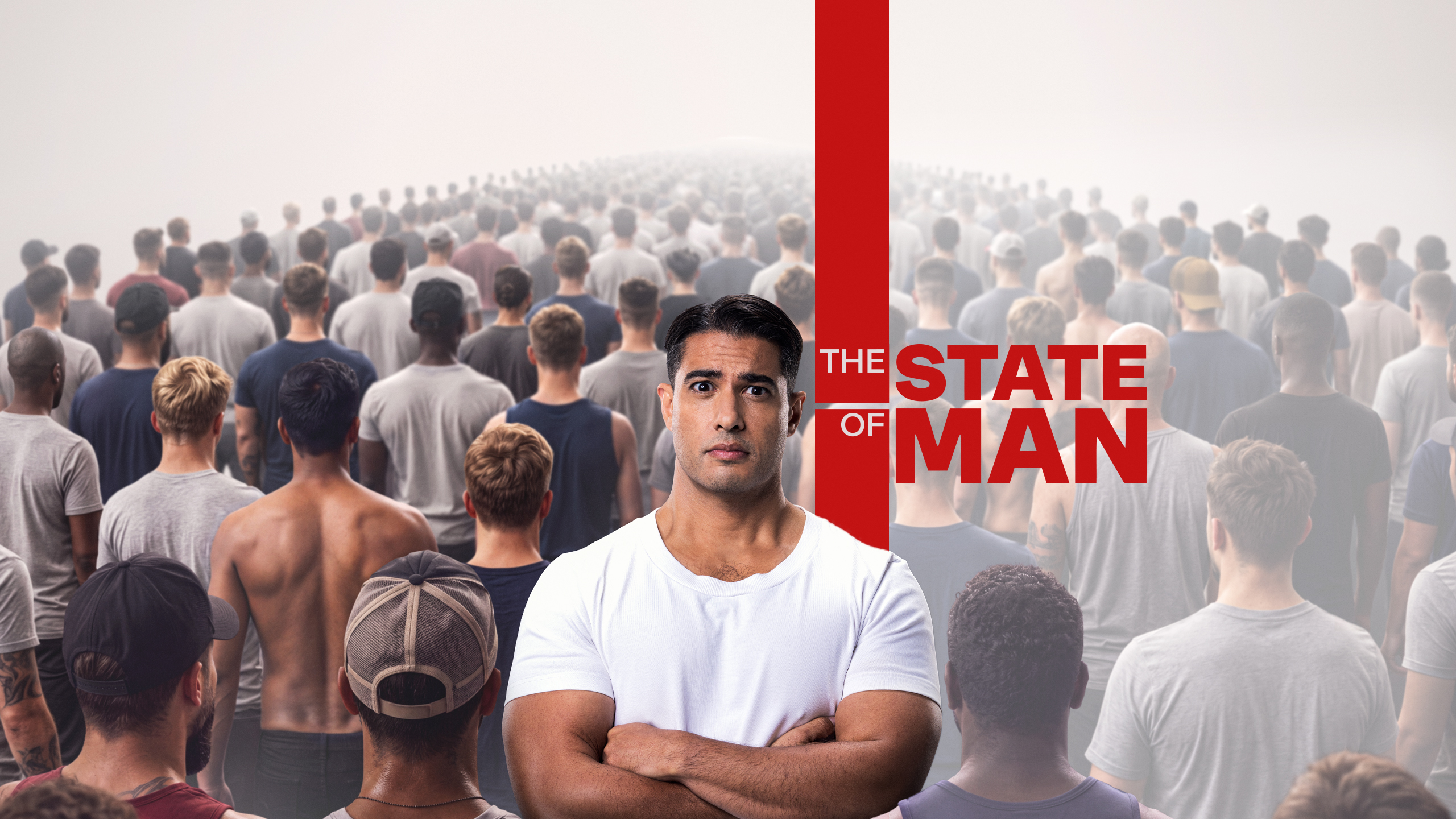 Journalist Marc Fennell stands facing the camera with his arms crossed, surrounded by a crowd of men facing away from the camera.