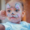 Young girl with her face painted