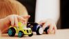 Toddler playing with trucks